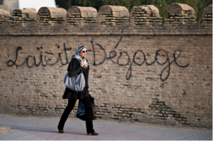 Graffiti against secularism in Tunisia. Photo by European Parliament via Flickr.