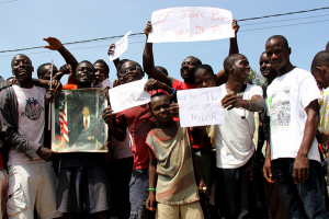 Supporters of Charles Taylor demonstrate the controversial nature of ICC work. Photo by tlupic via Flickr. 
