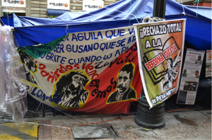 Protest banners from teachers occupying Zócalo Square in Mexico City. Photo by Ellie Warnick.